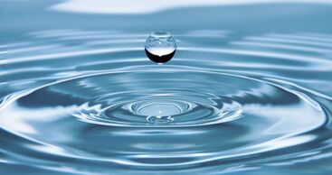 A water droplet falls into a pool and creates ripple effects | Advanced Therapy Institute of Touch, Colorado Springs creates ripple effects by helping their students and community heal in their Certification Programs