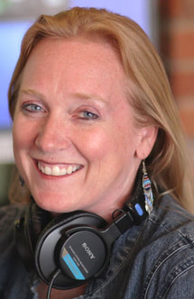 Kim M. Green, Founder of Advanced Therapy Institute of Touch at a radio microphone during one of her radio shows.