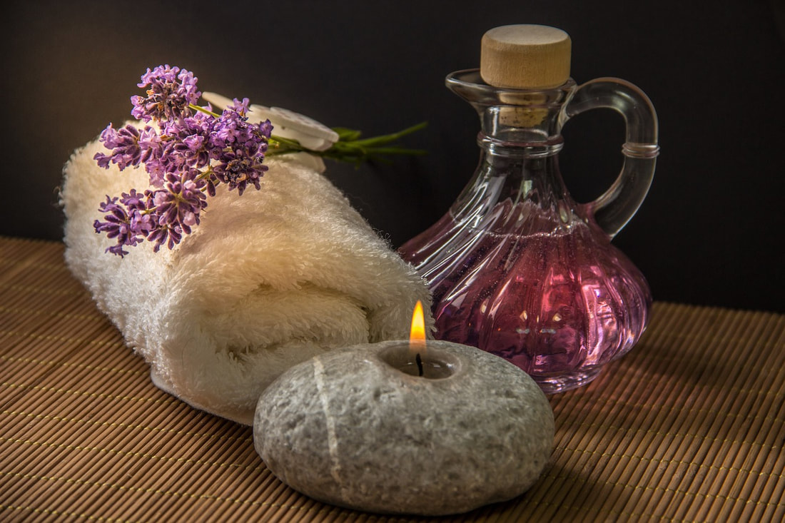 Plant Medicine, Herbal Caraffe, Rock Candle On A Bamboo Mat.  Learn Phytotherapy For Your Family | Advanced Therapy Institute of Touch, Colorado Springs
